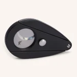 Cortador Xikar Xi80 preto com orifício de corte de 27mm em destaque